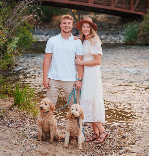 Photo of Ryan and Jessica Vineyard with their two small dogs